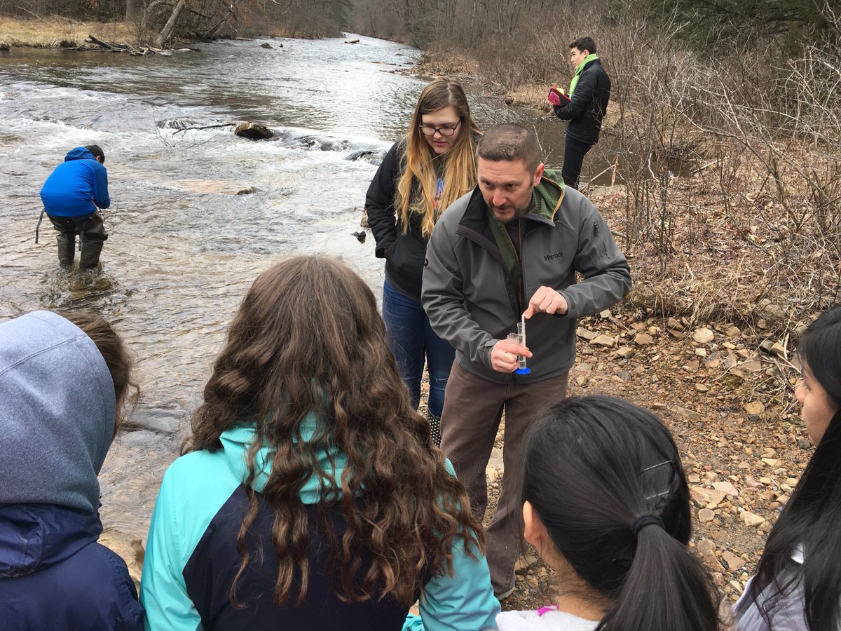 PSUEarth's tweet photo. Out in the field with @TeenShaleNet16 today for a mock spill in Black Moshannon Creek. The bright dye, which isn't harmful to the environment, gave students an idea of how big a job it can be responding to spills https://t.co/Rg3uAzc3NX