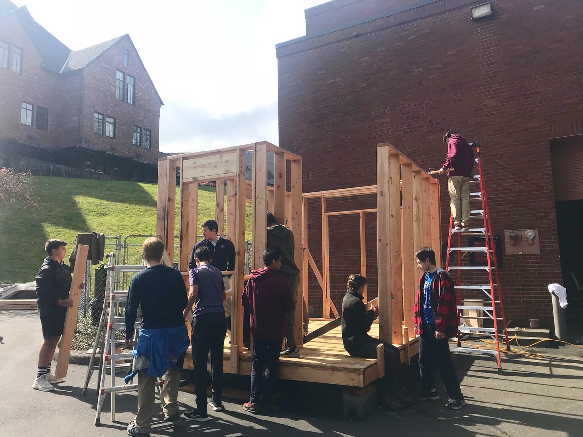 AnnieWright1884's tweet photo. The Upper School for Boys launched a 6-month project in January to build a tiny house for those experiencing homelessness in Seattle. Last Friday, the sunshine made an appearance—making it the perfect day for the boys to put the walls up! Updates at https://t.co/p0gwoffjps. https://t.co/OmDn9cAzLp