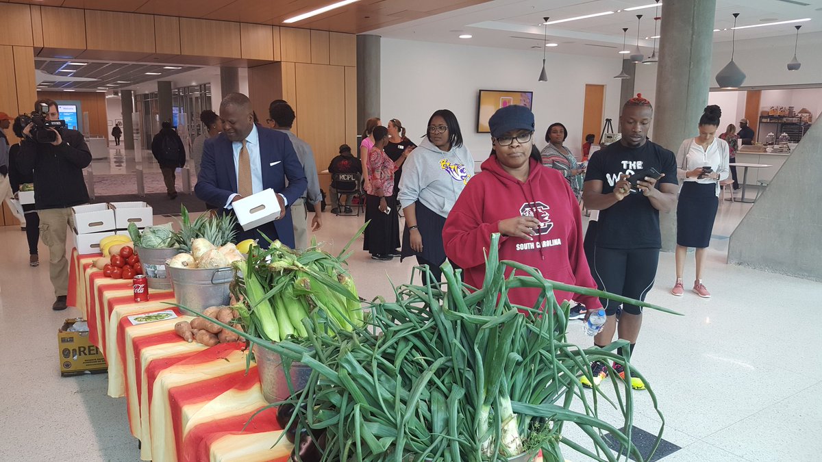 CityofColumbia's tweet photo. @SteveBenjaminSC and walkers are in Richland Library's weekly farmers market picking up fresh and local produce. #WeAreColumbia https://t.co/2EglfQ1RHB