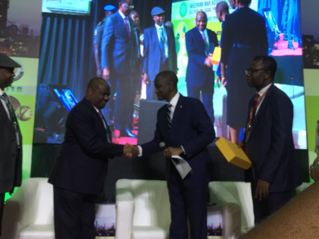 OPNBAofficial's tweet photo. @abmtwitt presenting an artwork to Rivers State Governor @Gov_Wike on behalf of the NBA, for his immense contributions to the Nigerian Bar Association.

The painting was done by Johnson Uwadinma, a contemporary Nigerian artist who lives in PortHarcout. #OPNBA #NBASLPConference https://t.co/V6lYe1h4tH