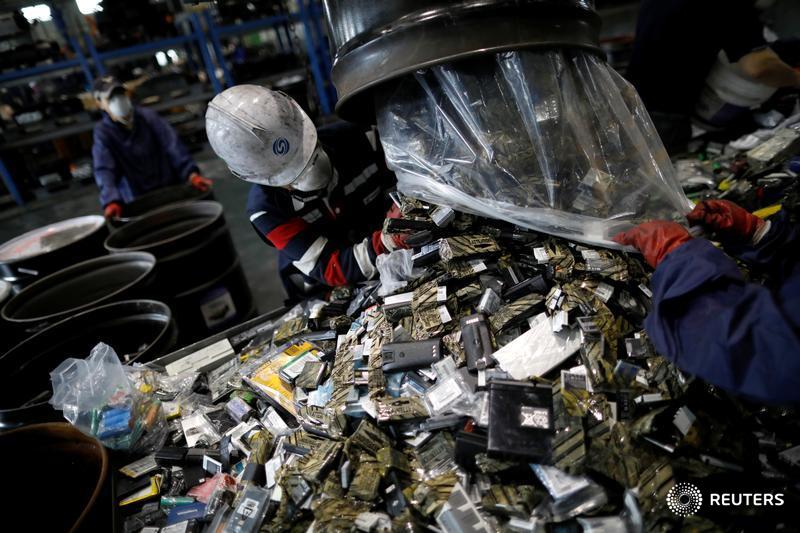 Reuters's tweet photo. Workers at a rural South Korean factory are busy extracting some of the world’s most coveted metals, used in the batteries that power electric cars https://t.co/2GLb3qLEaC https://t.co/u2t05P6fUn