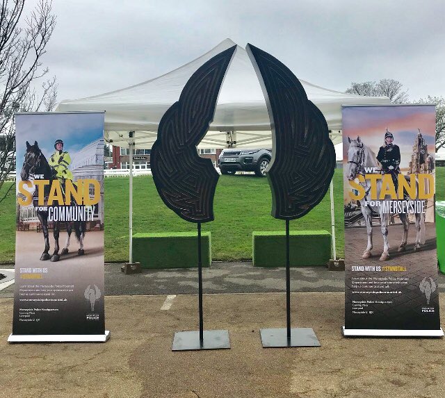 CurlyAbbie's tweet photo. Our banners and wings looking great at @AintreeRaces today! If you’re at the #GrandNational  this weekend, have a selfie and show your support @globalmmp @MerPolMounted #StandTall https://t.co/5PfSfaVWRC