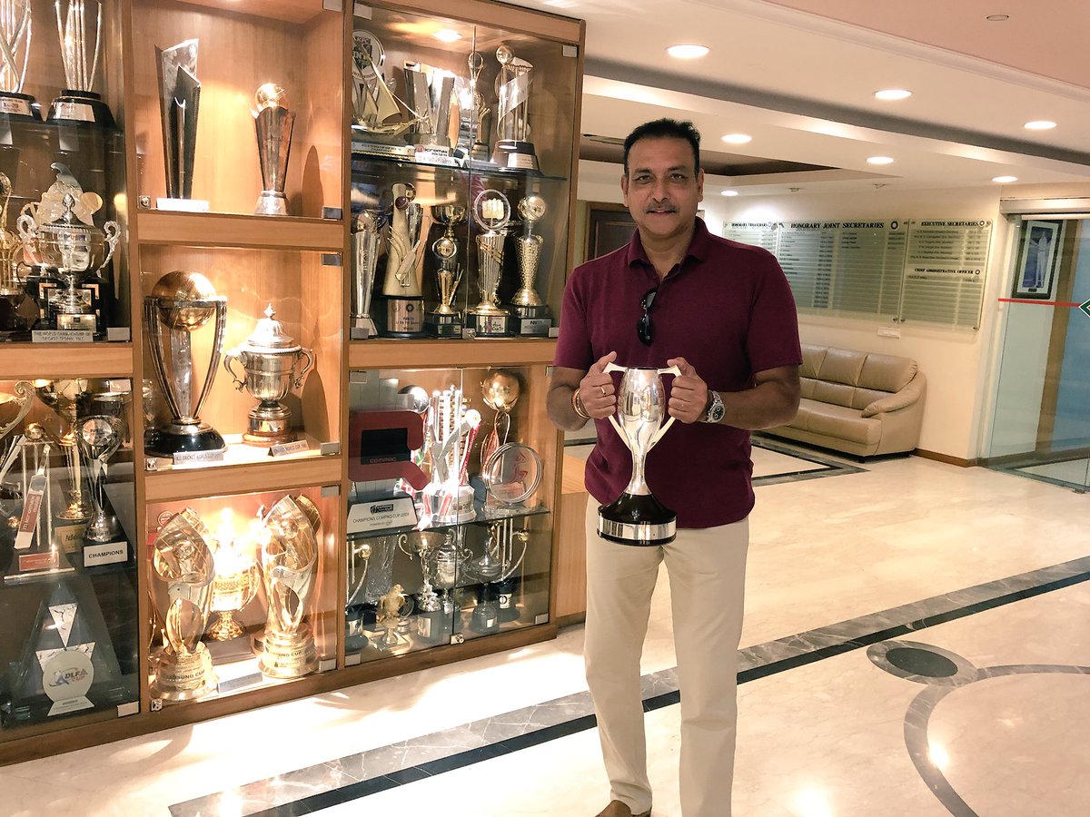 RaviShastriOfc's tweet photo. Great to hold the world championship of cricket trophy after 33 years #TeamIndia https://t.co/rO8chAvJE1
