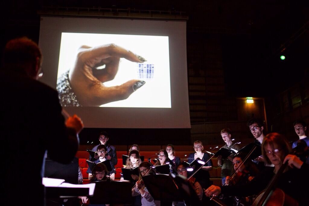 UniKent_Music's tweet image. Photos of the recent performance by the Cecilian Choir and String Sinfonia of the Sunrise Mass by Ola Gjeilo, bringing together live #music and media projections by @biokent in the #CellularDynamics project #choral #music