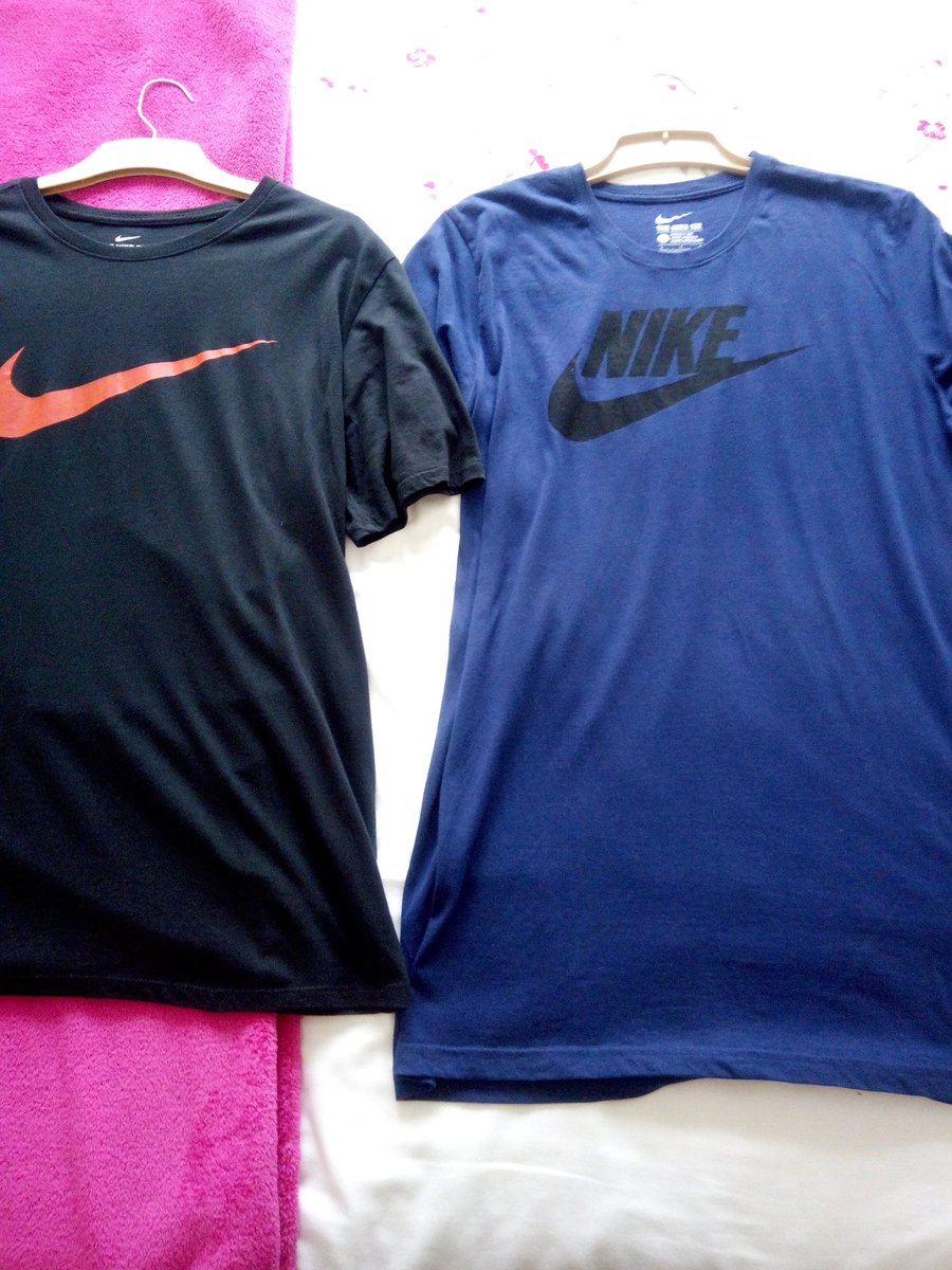 WES_Legend_4eva's tweet photo. @nikestore @Nike @nikesportswear these 2 t-shirts are both mens large. As you can see the blue one is longer which was made in South Africa. The black one is made in India. I have about 8 nike t-shirts that are made in India that I can't wear because it's too short on my stomach. https://t.co/f8e0qjQV66
