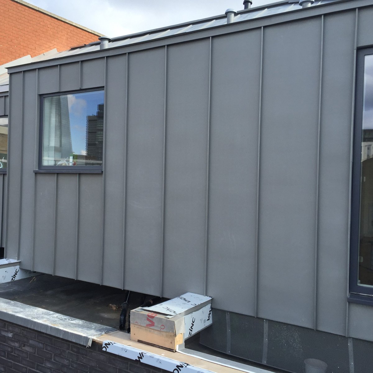 At Bermondsey Street we installed traditional standing seam panels to a high end penthouse. This project involved several different pitches and slopes integrating into one roof. Curved cassette style panels were also installed to the surround of a curved window.