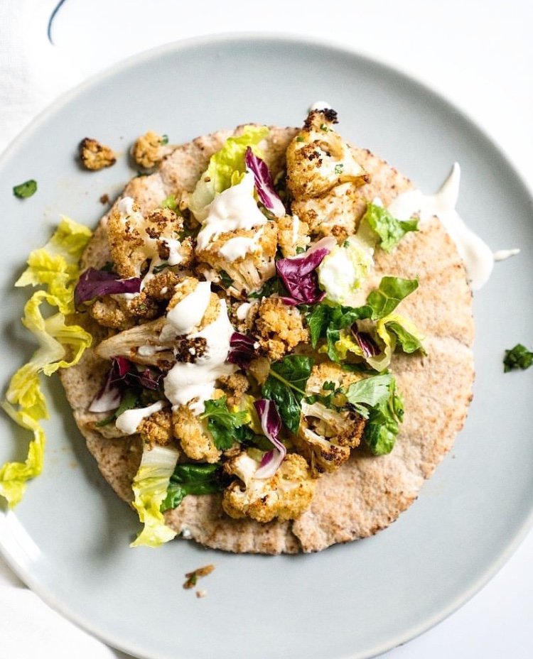 Shawarma-seasoned cauliflower = our new lunch obsession. Recipe in @kristincdonnelly's Cauliflower cookbook. (📷: @acouplecooks)