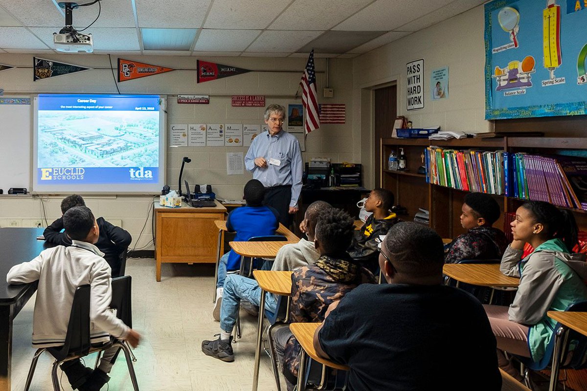 ThenDesignArch's tweet photo. Architect Brad talks to sixth grade students about what it's like to be an architect designing the new schools at @EuclidCentral Middle School Career Day. These students will be the first graduating class to attend grades 9-12 at the new @euclidschools High School. #OurEuclid https://t.co/2VaxYkrPqm