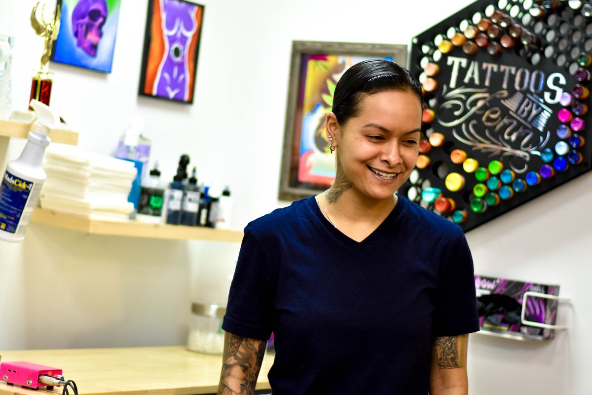 WorkingSyracuse's tweet photo. Jenn Cordero, an artist at Carmelo’s Ink City in Syracuse, talks on Working: Syracuse about life as a woman in the tattoo business. Jenn uses the walls of her work space to display her bright paintings, much like her body is a canvas for her life story told through tattoos. https://t.co/1p0FVzgEWF