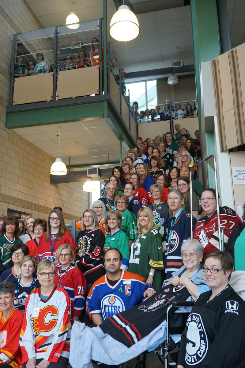 AHS_CentralZone's tweet photo. Over 125 Staff at the Red Deer Regional Hospital Centre gathered at lunch to show their support for the #humboldtbroncos. The team, their families and friends remain in our thoughts. We stand by you. #jerseysforhumboldt https://t.co/mNBtVvZlKF
