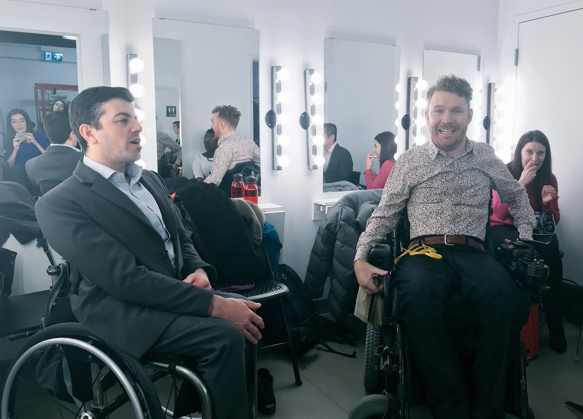Luke Anderson, right, and Joel D, left sit in the green room. Both are wheelchair users.