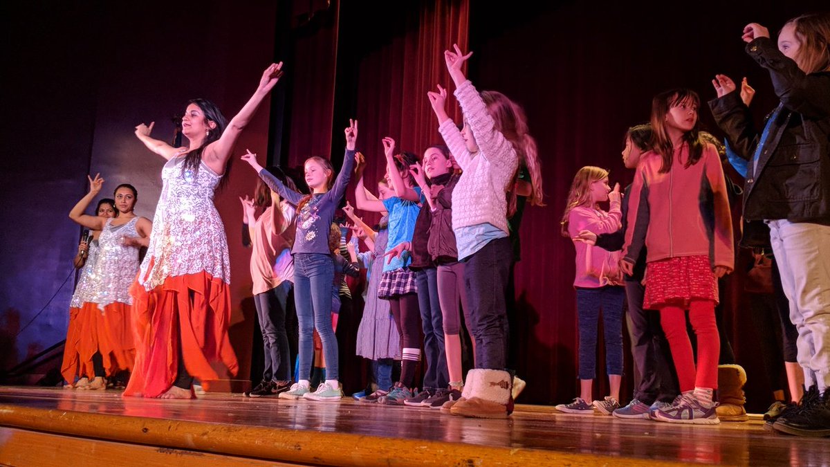 TheWFEE's tweet photo. #geographynight Nazar teaching Bollywood style dance. 7th graders welcoming 5th graders to school https://t.co/Z73bnxgXlM