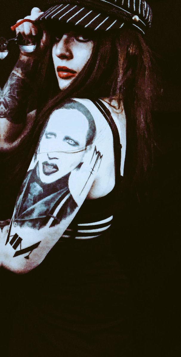 #mm #marilynmanson #mmink #tattoos #marilynmansontattoo #charlotterusse #outfit #ashcostello #sunglasses #batman #dccomics #catwoman #tattoo #paleemperor #goldenageofgrotesque #bornvillain #redlips #longhair #hat
