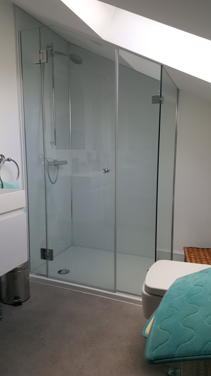 WindsorGlass's tweet photo. As the foot print becomes smaller so the use of available space has become more important. The use of using a loft for a bathroom creates its own issues, usually it is the shower screen that has to be designed to fit into awkward spaces, the pictures show what is possible https://t.co/3SOADPgREg