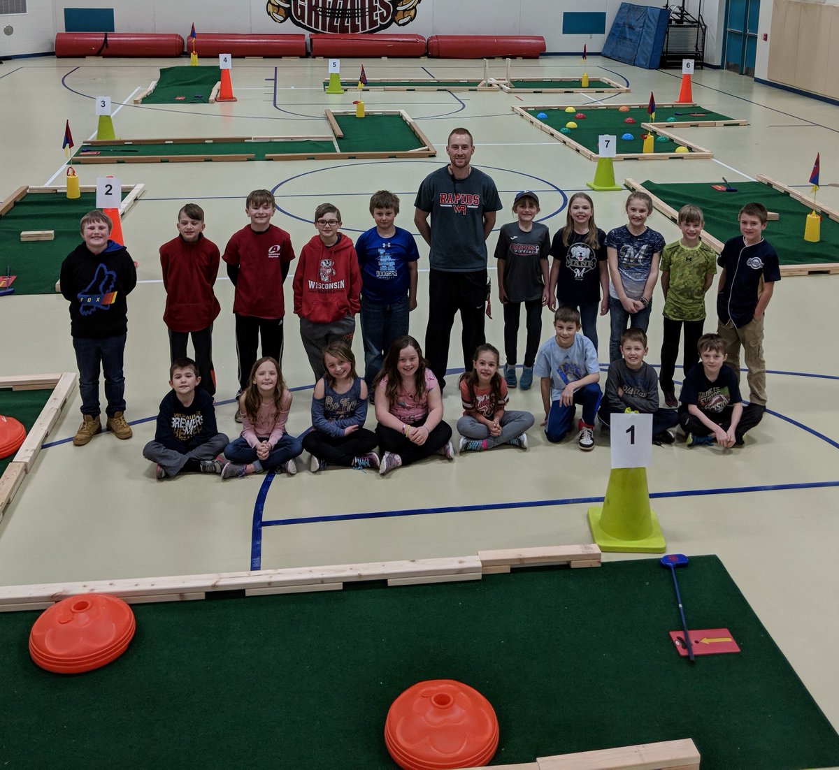 WRPSDistrict's tweet photo. Mr. Wolding developed an AWESOME mini golf course for our students - they look pretty happy to be in Phy Ed today! #RapidsPride #makinglearningfun #PhyEdrocks β³οΈ https://t.co/i3kUMvV5TS