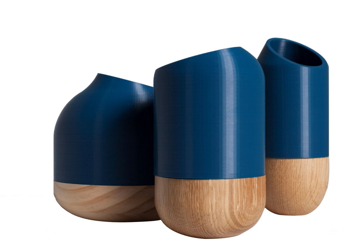 SPENDINmagazine's tweet photo. "Half Cut" by #DosStudio. Su #diseño juega con el contraste entre su parte superior liviana hecha de fibras recicladas utilizando tecnología de impresión 3D y una base sólida, pesada y elaboradahecha de madera natural pulida. #Art https://t.co/ZLmug0QIwe
