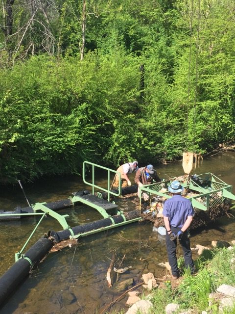 GainesvilleH2O's tweet photo. The trash trap along Flat Creek continues to collect trash that is thrown into the creek. Without the trap the trash would eventually make its way into Lake Lanier. Environmental Service staff cleaned the trash trap on Thursday morning. https://t.co/rLhV9xG2pe
