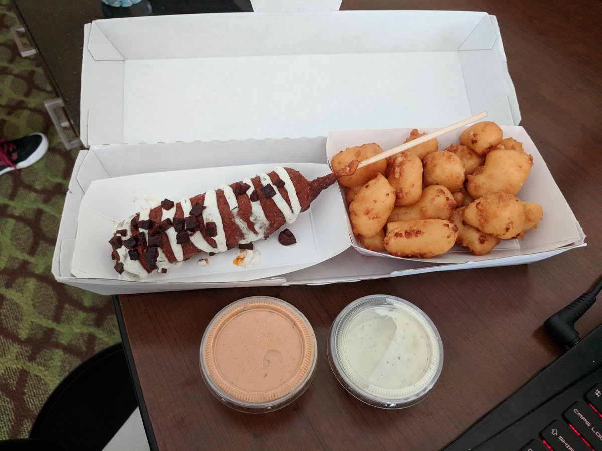 Imaginarykitchn's tweet photo. I am loving this work trip to #philly @foxandsonphilly from #readingmarket. Sweet potato battered corndog with chorizo and sour cream along with fried cheese curds. Damn this is good! 10/10 will visit when i'm in town again! Thanks for the dollar coin in exchange for a 2$ bill! https://t.co/uoiZOqGeA6