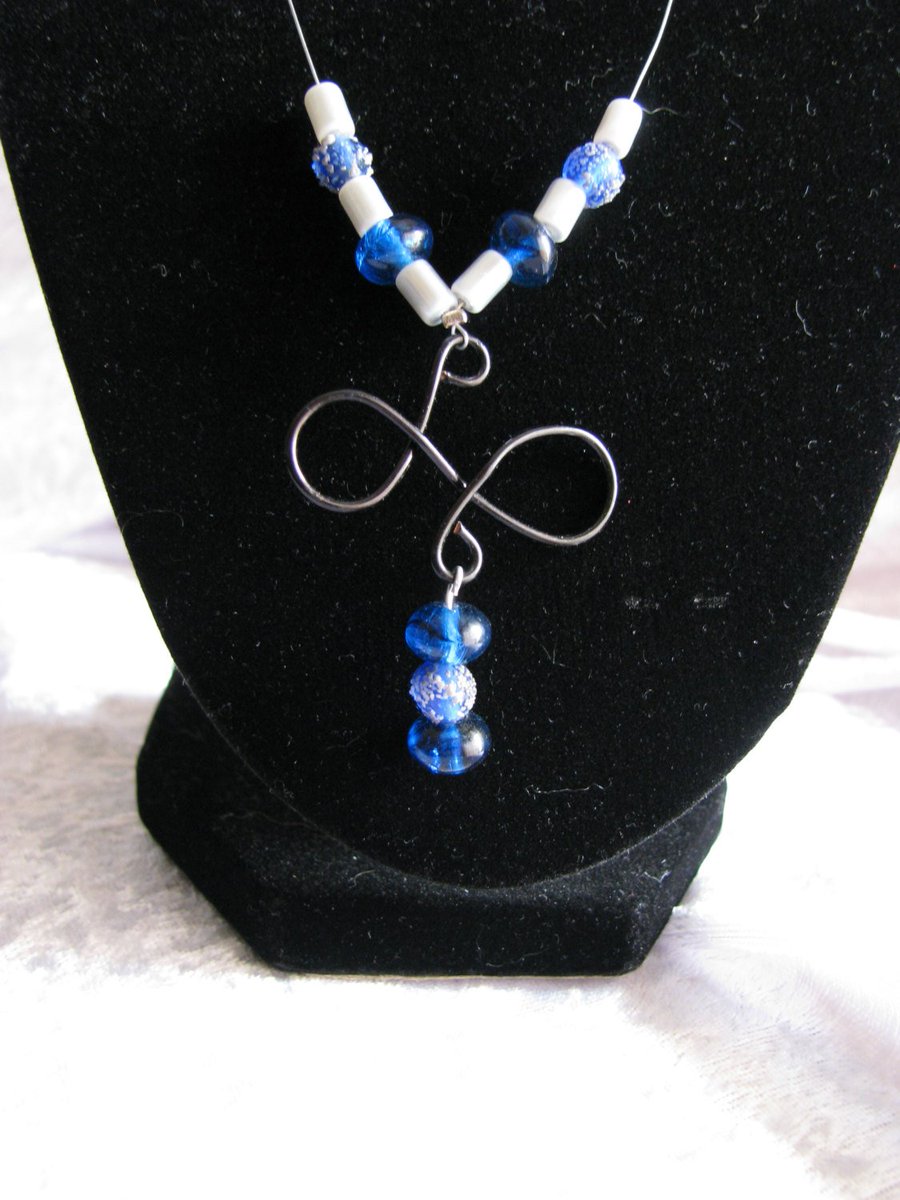 randomjewelry's tweet photo. Blue and Silver Necklace with Wire Pendant https://t.co/ehITd13365 #shoplocal #handmade #RandomJewelry #Etsy #BlackWirePendant https://t.co/fVxJJWqKTe