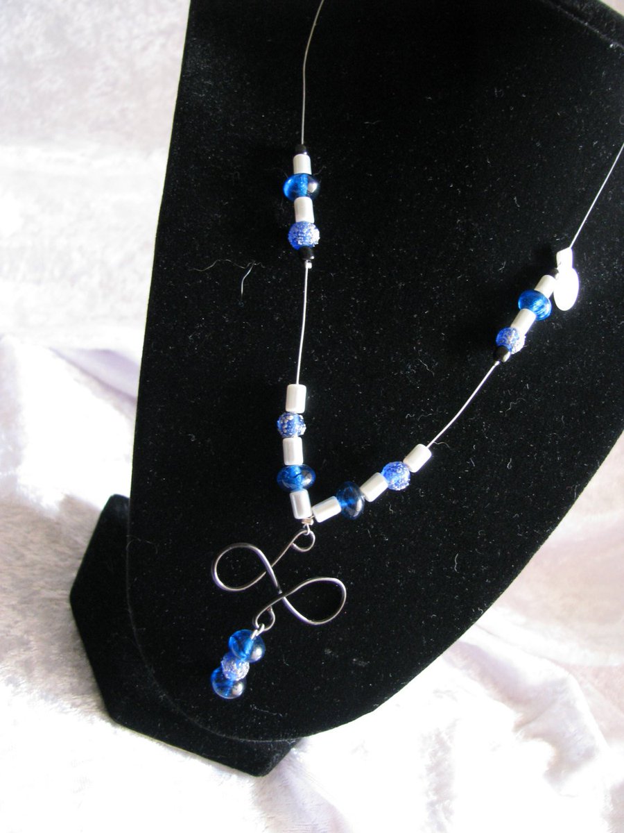 randomjewelry's tweet photo. Blue and Silver Necklace with Wire Pendant https://t.co/ehITd13365 #shoplocal #handmade #RandomJewelry #Etsy #BlackWirePendant https://t.co/fVxJJWqKTe