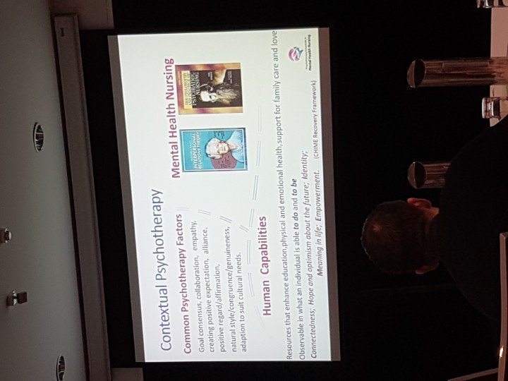 patmb49's tweet photo. #PMHC2018 - Robert Trett.  Psychotherapy in Nursing.  Not illness focussed.  Common Psychotherapy Factors, Human Capabilities, Interpersonal Relations Theory, are central to therapeutic effectiveness for MHNs.  Trauma Informed Nursing, neuroplasticity underpin hope. https://t.co/KQvnn09tR9