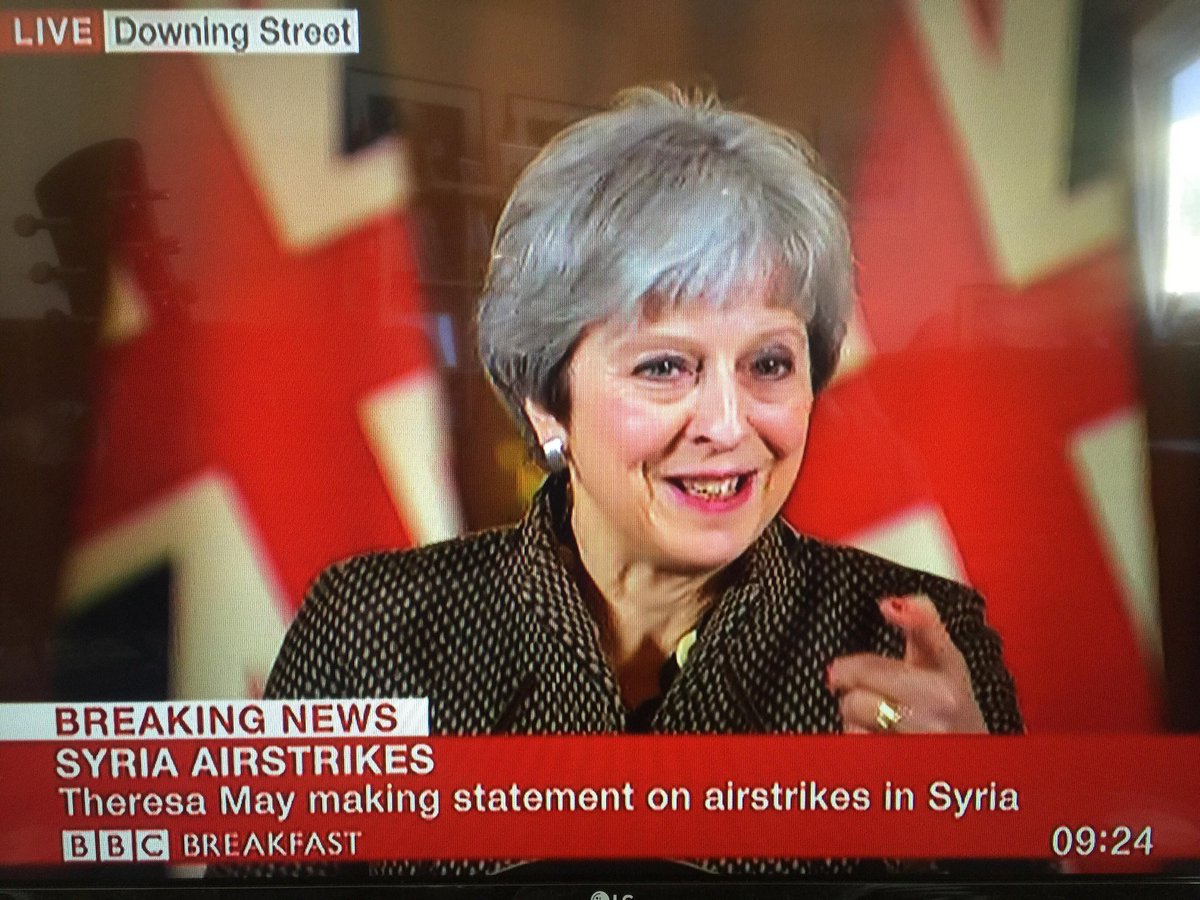 chelleryn99's tweet photo. Theresa May looking scarily pleased  with herself at the #SyriaStrikes press conference!

Reckon she thinks this is her Falklands moment. Let's prove her wrong on May 3rd when we #VoteLabour in vast numbers.

#NotInMyName https://t.co/cKKeWPVMQA