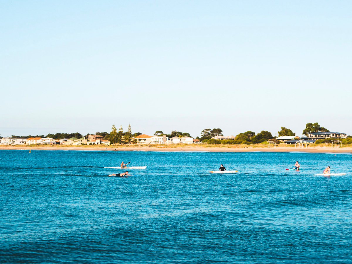 Water sports at sunset in Mandurah, Western Australia