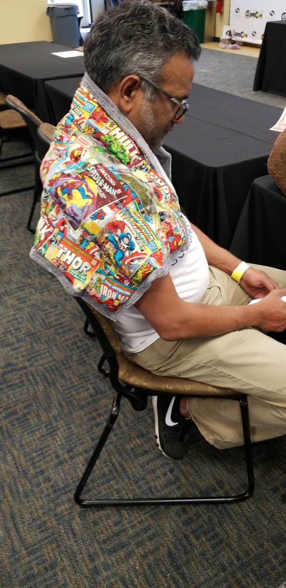 SensaCalm's tweet photo. @blanketlady needs some more help at @AspieCon 😁 Sri is covered up with an #avengers weighted wrap! By the way #GotLemon? https://t.co/Y0ncoWAzTW