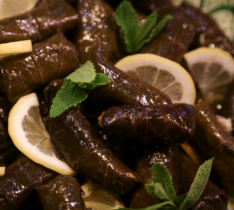 Dolma, dolmades or stuffed vine leaves! Grape vine leaves that are cooked, pickled and stuffed with rice, onion and mint. Great for a mezze style starter or party food. #fingerfood #realoliveco