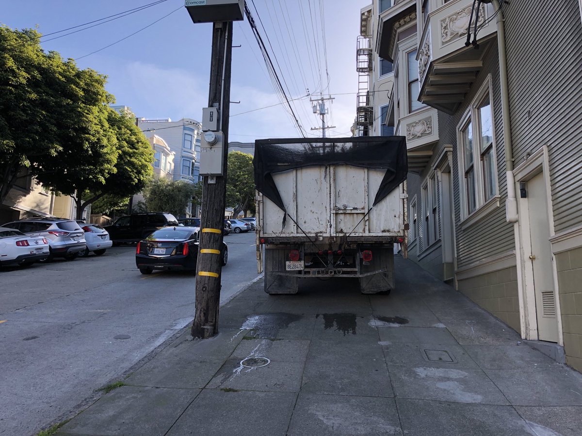 Truck parked on sidewalk
