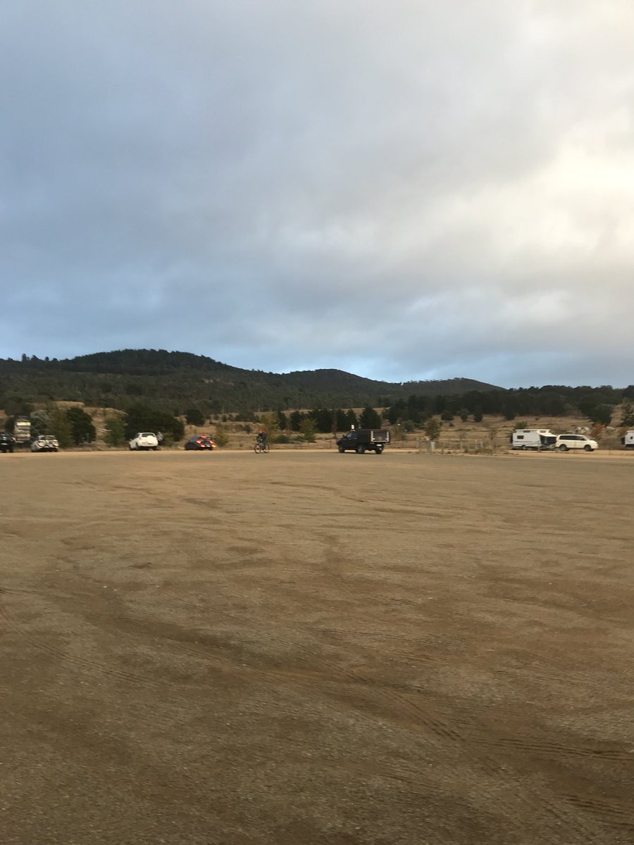 JustinMorrisTT1's tweet photo. Ominous looking conditions here at Mt Stromlo for the #AMB100 #xcm race today. Rain and cold winds! Lucky I got no teeth to chatter! 😬 GO @marathonmtb 💪🚴‍♂️. https://t.co/tfMbnOQjnb
