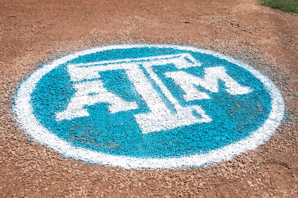 a teal Texas A&M logo painted in the dirt on the field