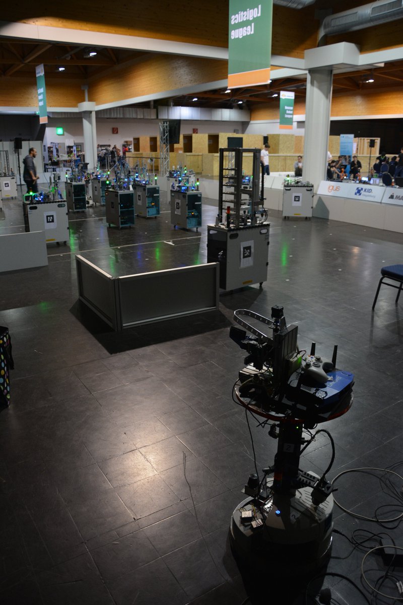 carologistics's tweet photo. To prepare for the playoff games, sometimes you need to put  some effort. After a night shift and getting very little sleep we are ready for the finals. Exploration tweaking, production optimization to deal with  communication dropouts and tuning the gripper.
#RoboCup https://t.co/z86APIBChi