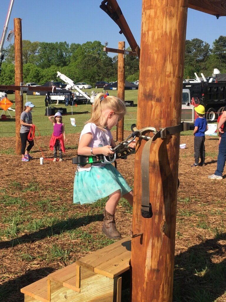 ElectriCitiesNC's tweet image. #futurelineworkers in the @PowerSecureInc Fun Zone at the #PublicPower #LineworkersRodeo