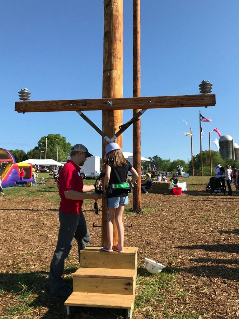 ElectriCitiesNC's tweet image. #futurelineworkers in the @PowerSecureInc Fun Zone at the #PublicPower #LineworkersRodeo