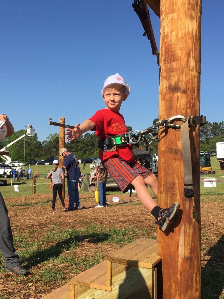 ElectriCitiesNC's tweet image. #futurelineworkers in the @PowerSecureInc Fun Zone at the #PublicPower #LineworkersRodeo