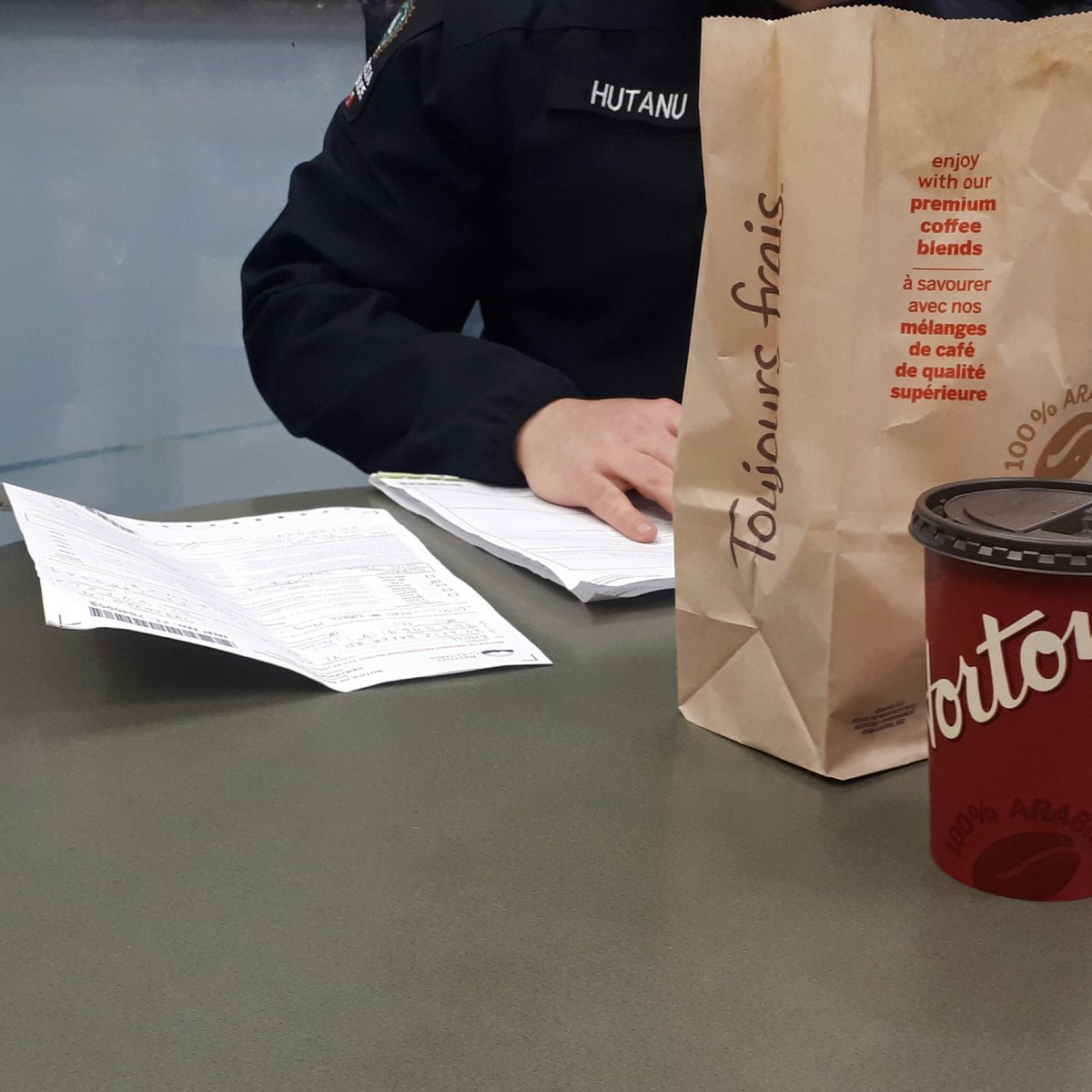 dpd_jingram's tweet photo. A Platoon's North Patrol team took 5 impaired drivers off the road tonight with a proactive checkstop. Our newest recruit Cst. Hutanu sitting down to write some of the associated paperwork... #SafeRoads https://t.co/jutNBhNF4M