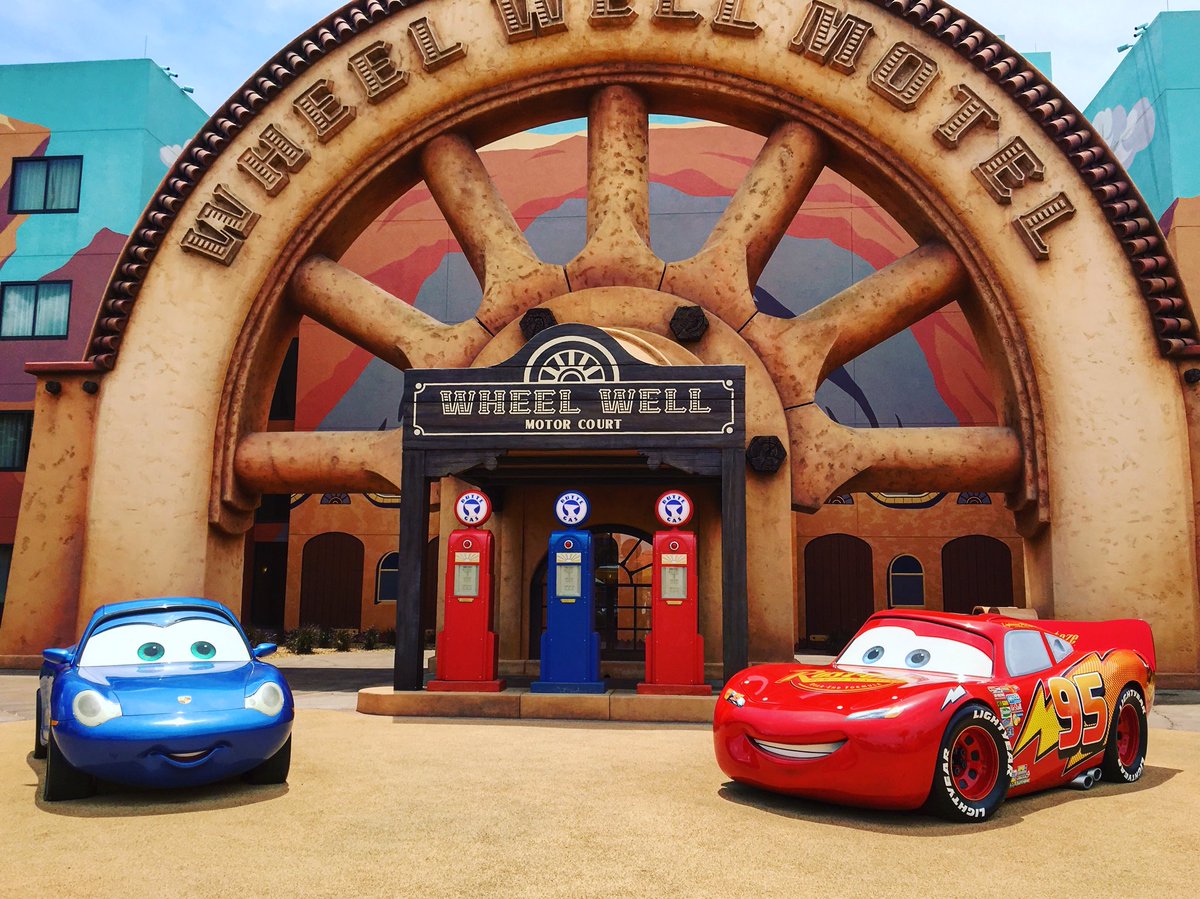 McQueen and Sally parked beneath the tree, K-I-S-S- uhhh... I-N-T! Loved exploring the detailed #cars #radiatorsprings area of Disney World’s #artofanimationresort 🚗😍😁 #Pixar #Disney
