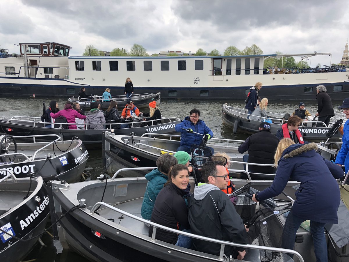 Mokumboot's tweet photo. he Kingsday aftermath... 200+ people went out fishing for plastic on the Amsterdam canals. We're very happy to support this @plasticwhale event and its volunteers. Great work everyone, thank you!! https://t.co/FaX12qwUGG