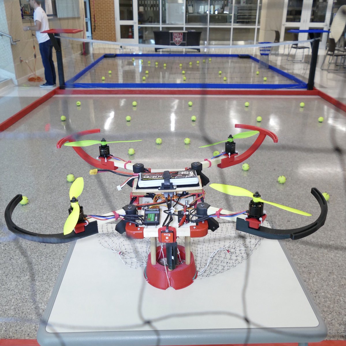 BellFlight's tweet photo. #BellDroneCompetition | This #drone from #TrinityHigh uses a net to entangle mutliple πΎ for a larger payload. After the net drops the landing gear acts like a rubber band cage to transport one πΎ at a time https://t.co/xmW5okBXRs