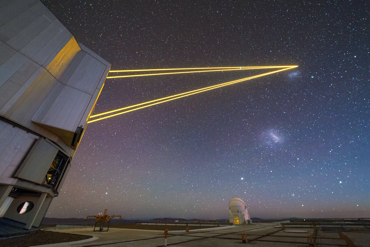 ESO_Ireland's tweet photo. Four lasers beam out from one of the Unit Telescopes of ESO's VLT, guiding your eyes to the Small and Large Magellanic Clouds beneath them. Credit: @ESO / P. Horálek https://t.co/fqTtgZHDL2 https://t.co/n6DWmVF4kS