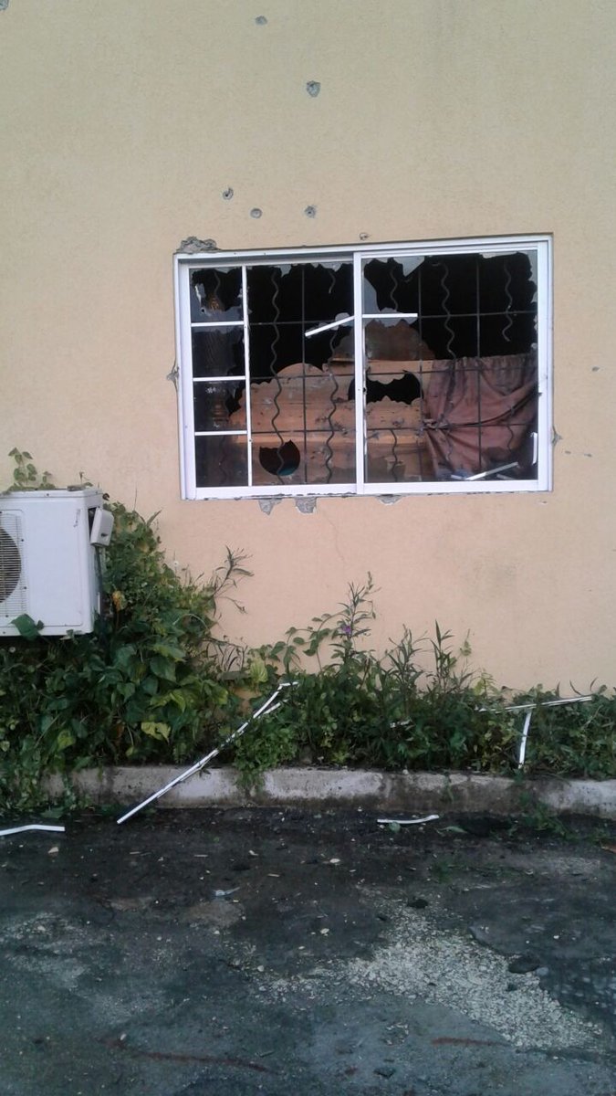 AbkaFitzHenley's tweet photo. UPDATE: House in Hartfield, Ironshore in Mobay where one of St. James' most wanted men &amp; feared Ski Mask gangster, Nico Samuels o/c #Bowza was cut down by the security forces after an intense gun fight. He was wanted for at least 8 murders &amp; the burning down of several houses. https://t.co/AjOaXdgwTY