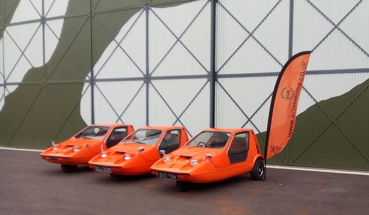 JonFray's tweet photo. The name's Bond. #BondBug @BrooklandsMuseu today. Are there any cars more 70`s than these? Orange Arrows. https://t.co/5G6B6ae5Cv