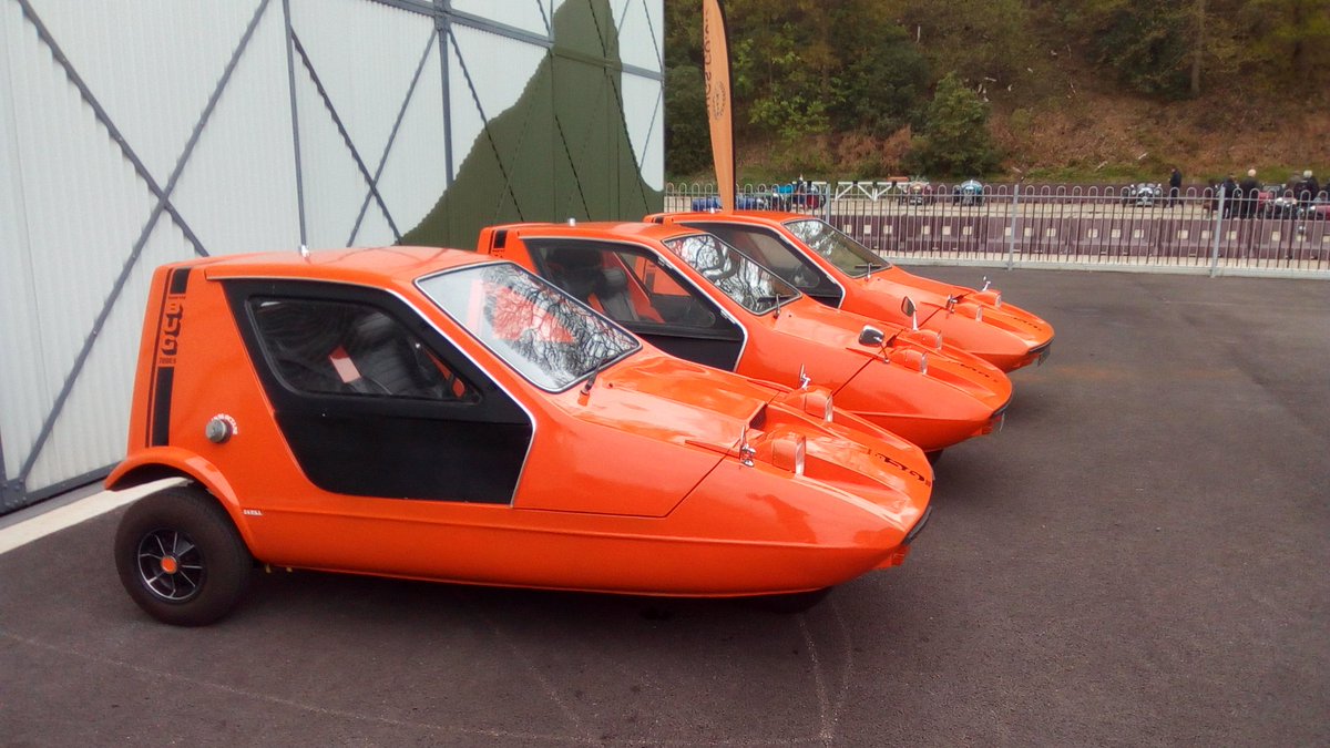 JonFray's tweet photo. The name's Bond. #BondBug @BrooklandsMuseu today. Are there any cars more 70`s than these? Orange Arrows. https://t.co/5G6B6ae5Cv