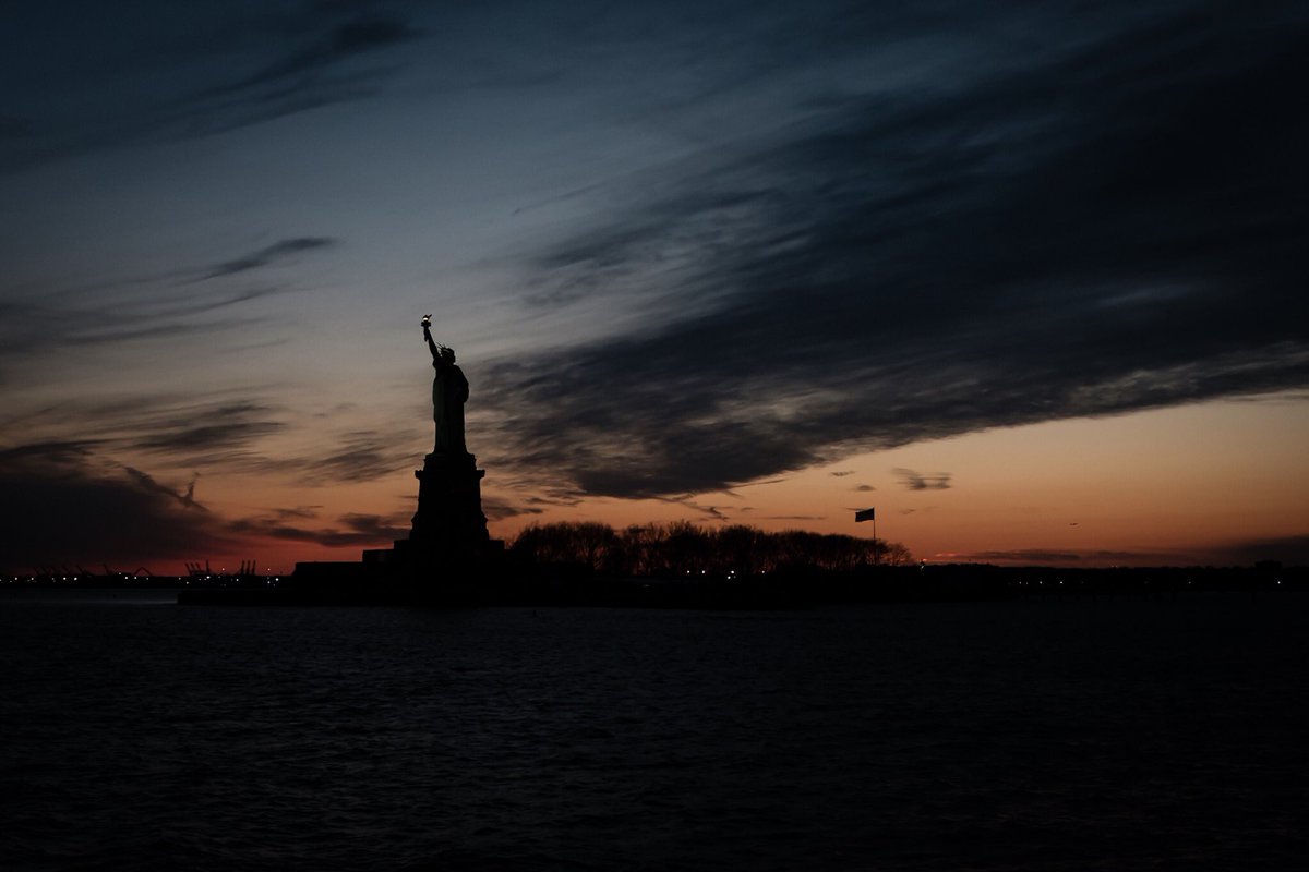 CoreyBourassa's tweet photo. Statue of Liberty silhouette https://t.co/yr2BTtEdrM #fujifilm_xseries #x100f #NewYorkCity #sunset https://t.co/cQqaGQVby0