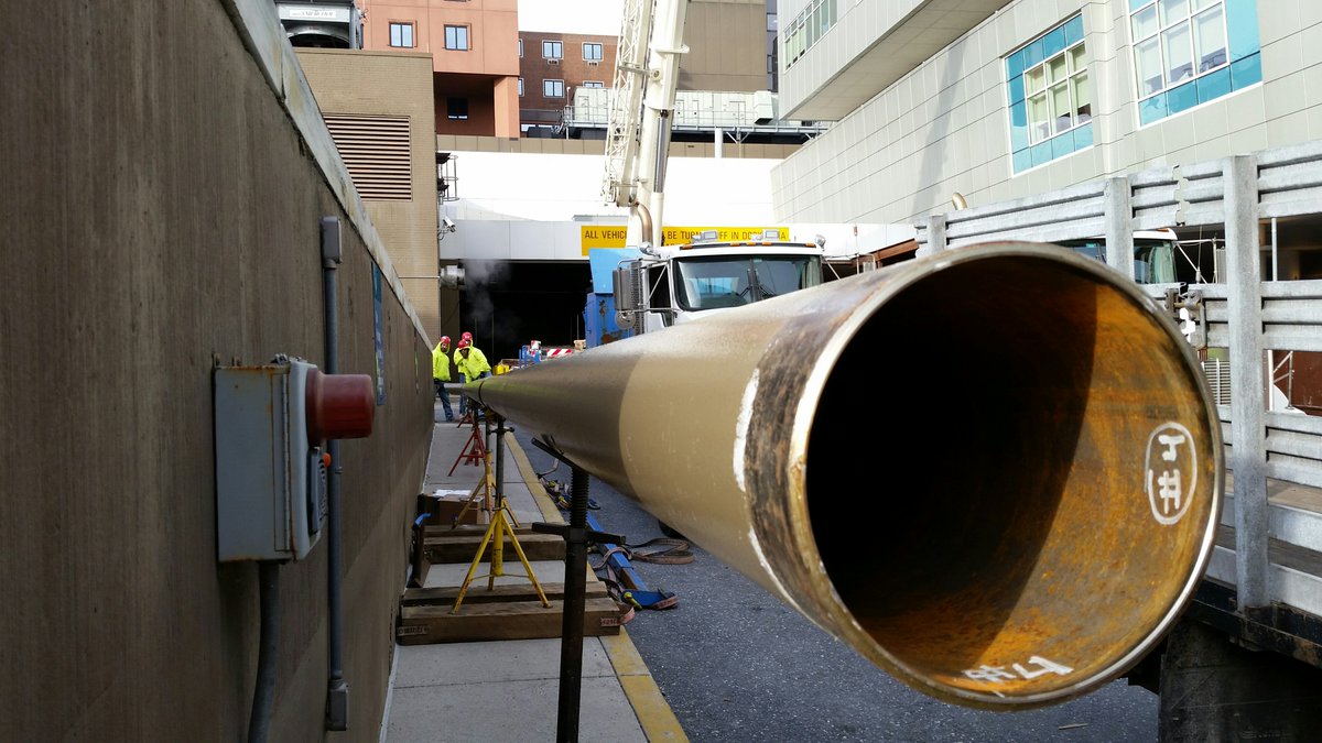 JamesCRAFTSon's tweet photo. These exhaust pipe extensions (connected to a large diesel generator) were pre-fabricated in our shop, transported to the site, welded together on the ground, then lifted into place by a crane. https://t.co/8YBLZVchph