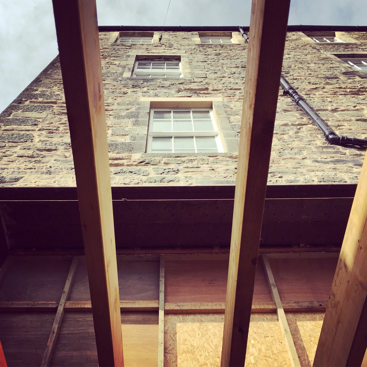 Looking up from the new lower ground extension at the rear of the Dublin Street project, where a previously formed opening at the back on ground floor has been fully exposed #townhouse #stone #windows #structure #edinburgh #newtown