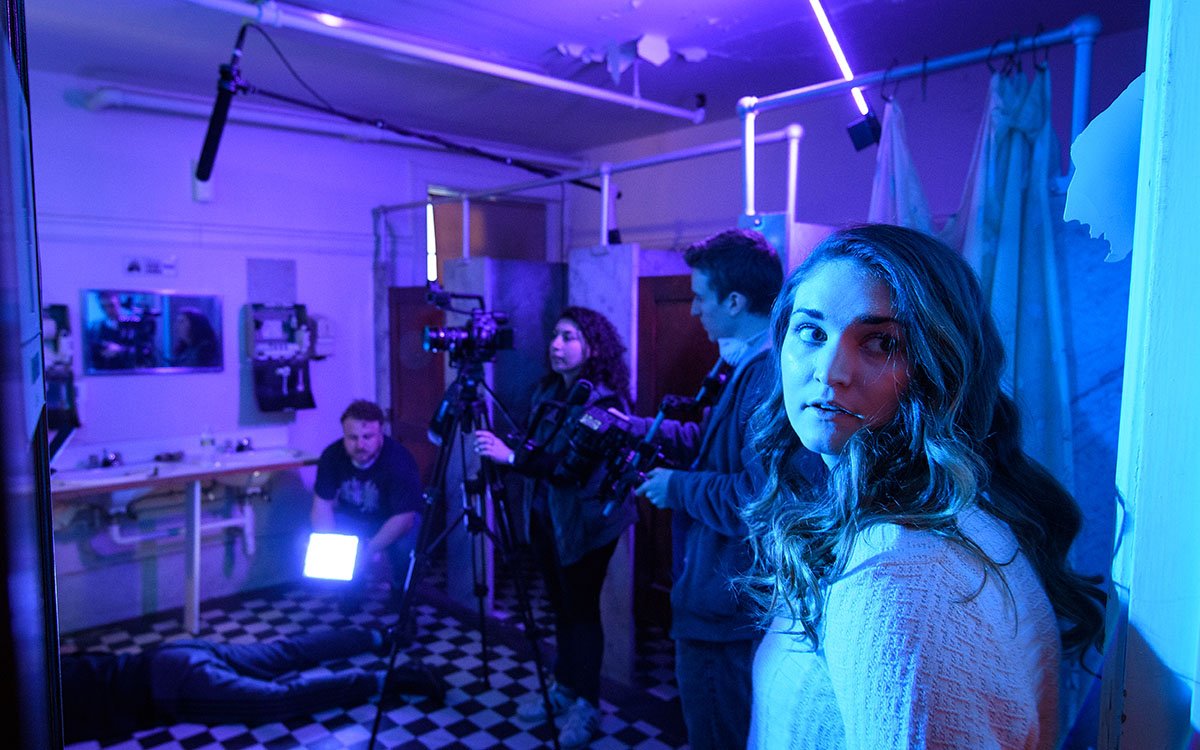 ClarkMCA's tweet photo. Actor and @ClarkMCA junior Bridgette S. (@Bsullzzz, foreground) waits between takes on set of the @ClarkUScreen production of EYELINE, a #ProblemsOfPractice course @ClarkUniversity. https://t.co/jdLFimUt8Q