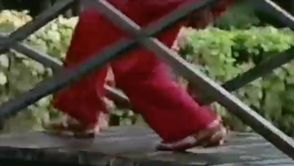 Okay, call Ate Shawie's sudden levitation 'creative license', but we'll get back to that later. So after flying off to god knows where, we see a creepy image of Ate Shawie's disembodied feet landing on a bridge. After which, she interacts with a child.