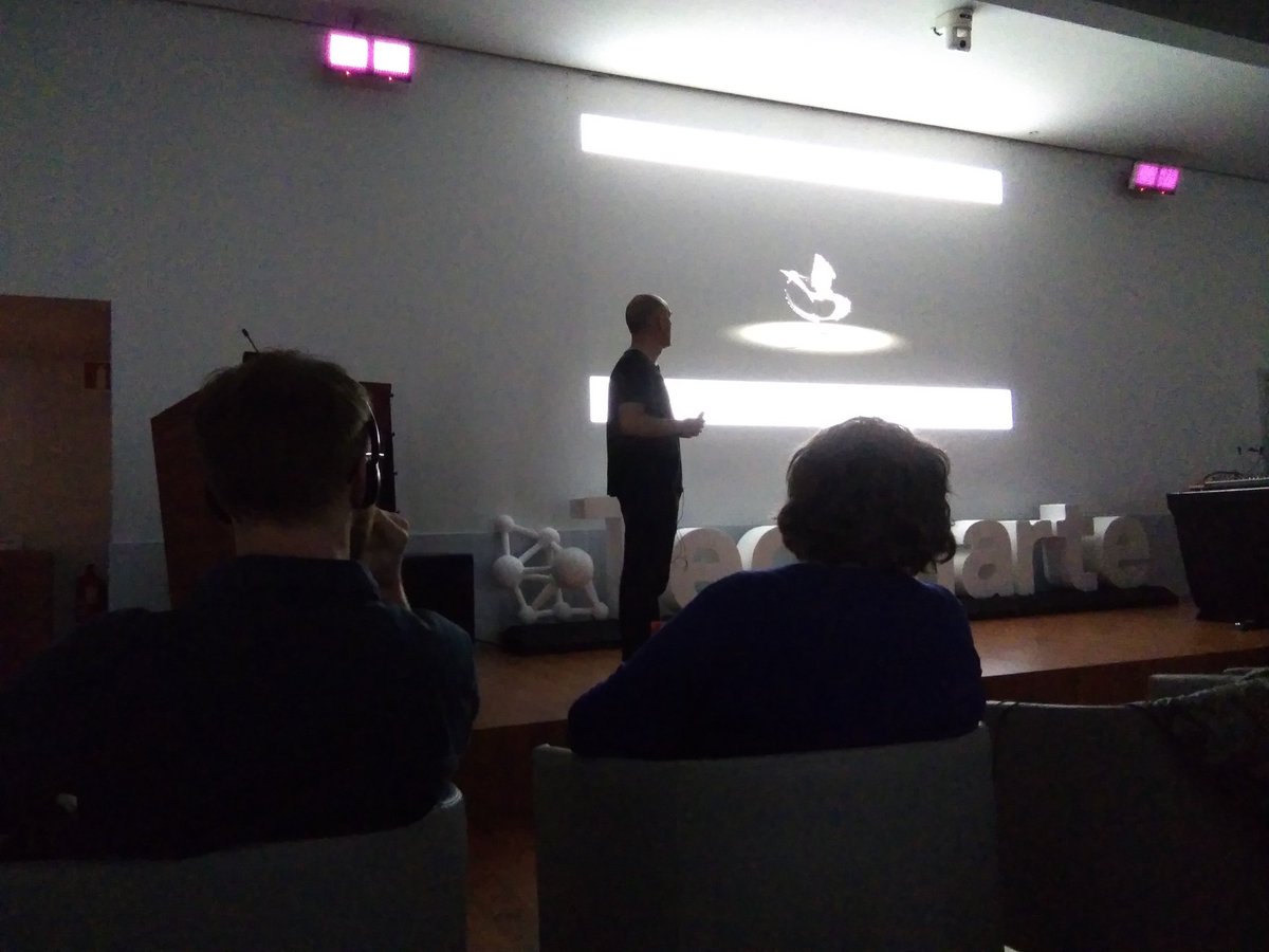 Technarte's tweet photo. Patxi Araujo from #FineArts Faculty of @upvehu explaining his Trained Particles Circus. #GenerativeArt #Sound #Noise #Concert #Technarte #Bilbao https://t.co/B2N4w3RkxW